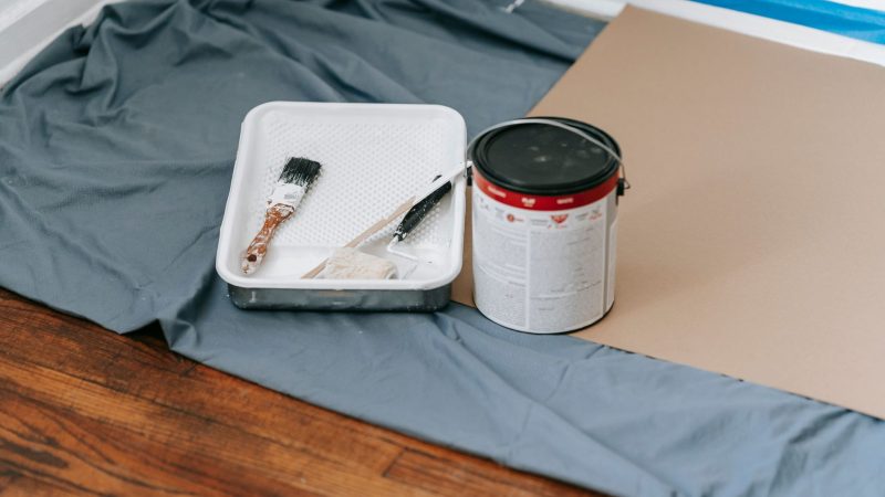 A collection of painting tools and materials prepared for a home renovation project indoors. — Do It Yourself Ideas To Consid