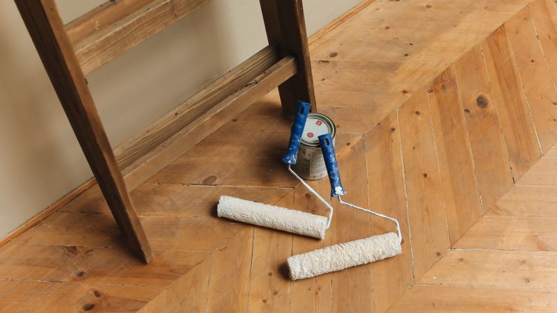 Paint rollers and ladder on a wooden floor, perfect for DIY renovation projects. — Home Bars Like a Simple Do It Yourself