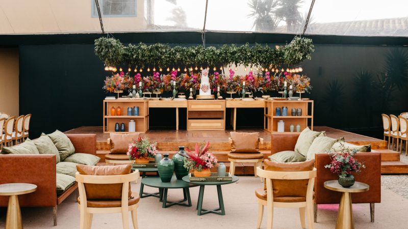 Luxurious indoor event setup featuring elegant seating and vibrant floral arrangements. — Interior Decor is definitely an Exp