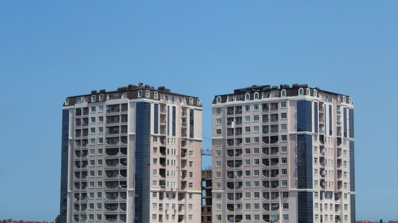 High-rise residential buildings under clear blue sky showcasing modern architecture. — What to anticipate From Realtor?